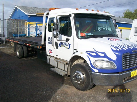 Shows an Arbuckles Flatbed Tow Truck that serves the New Glasgow region